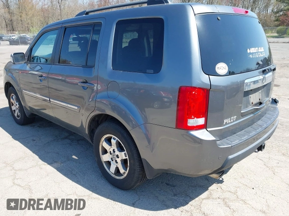 2011 Honda Pilot Touring with VIN 5FNYF4H94BB035415, listed as a IAAI auction lot 42126738 with 239,273 mi miles. Bid and sale history available at carsss.com. Image 3.