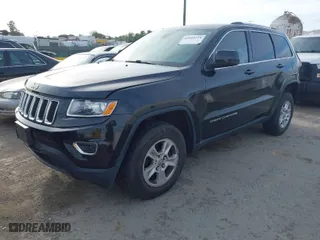 2014 Jeep Grand Cherokee Laredo with VIN 1C4RJFAG9EC516138, listed as a IAAI auction lot 42055214 with 135,701 mi miles. Bid and sale history available at carsss.com. Image 2.