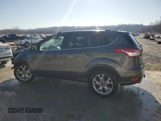 2016 Ford Escape Titanium with VIN 1FMCU9J91GUB34663, listed as a Copart auction lot 48044425 with 104,565 mi miles and Salvage Title. Bid and sale history available at carsss.com. Image 2.