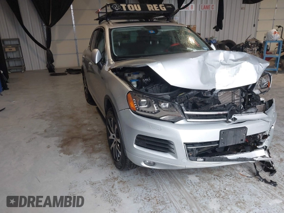 2011 Volkswagen Touareg Exec with VIN WVGFK9BP4BD005986, listed as a IAAI auction lot 41183877 with 109,005 mi miles and . Bid and sale history available at DreamBid. Image 1.