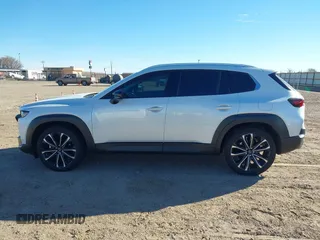 2024 Mazda CX-50 Premium z VIN 7MMVABDY0RN186511, wystawiony jako IAAI lot #41229255 z przebiegiem 21 842 mil mil oraz . Historia ofert i sprzedaży dostępna na DreamBid. Obrazek 14.