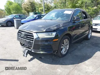 2017 Audi Q3 Premium Plus z VIN WA1JCCFS5HR001068, wystawiony jako IAAI lot #42038452 z przebiegiem 136 661 mil mil oraz . Historia ofert i sprzedaży dostępna na DreamBid. Obrazek 2.