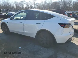 2024 Tesla Model Y with VIN 7SAYGDED9RF094494, listed as a Copart auction lot 50298115 with 7,858 mi miles and Salvage Title. Bid and sale history available at DreamBid. Image 2.