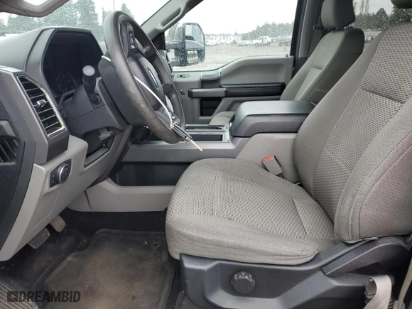 2015 Ford F-150 XLT w/HD Payload Pkg with VIN 1FTFW1EG0FFC08308, listed as a Copart auction lot 49697285 with 144,069 mi miles and Salvage Title. Bid and sale history available at carsss.com. Image 7.