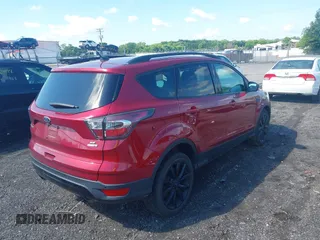 2017 Ford Escape SE z VIN 1FMCU9GD4HUA10240, wystawiony jako IAAI lot #42392522 z przebiegiem 82 325 mil mil oraz . Historia ofert i sprzedaży dostępna na DreamBid. Obrazek 4.