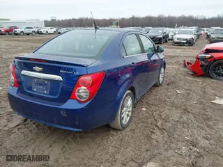 2014 Chevrolet Sonic LT with VIN 1G1JC5SG7E4117814, listed as a IAAI auction lot 41711814 with 97,723 mi miles. Bid and sale history available at carsss.com. Image 4.