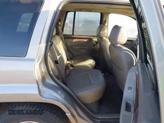 2001 Jeep Grand Cherokee Limited with VIN 1J4GW58N61C670589, listed as a IAAI auction lot 41817712 with 185,905 mi miles. Bid and sale history available at carsss.com. Image 8.