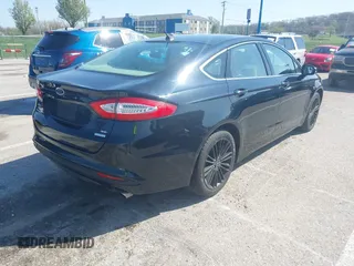 2014 Ford Fusion SE with VIN 3FA6P0HD4ER291323, listed as a IAAI auction lot 41952990 with 148,583 mi miles. Bid and sale history available at carsss.com. Image 4.