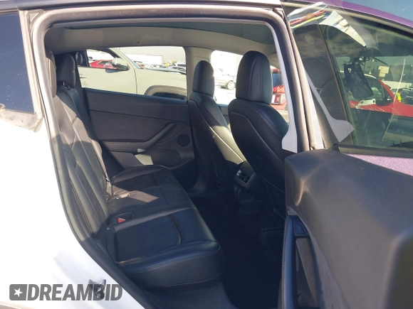 2021 Tesla Model Y Long Range with VIN 5YJYGDEE7MF224531, listed as a IAAI auction lot 38454442 with 52,408 mi miles. Bid and sale history available at carsss.com. Image 8.