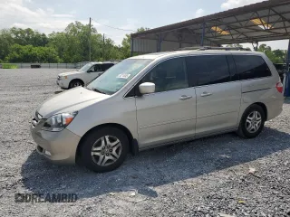 2006 Honda Odyssey Touring z VIN 5FNRL38866B506730, wystawiony jako Copart lot #54214865 z przebiegiem 241 982 mil mil oraz Szkoda całkowita • Salvage title. Historia ofert i sprzedaży dostępna na DreamBid. Obrazek 1.