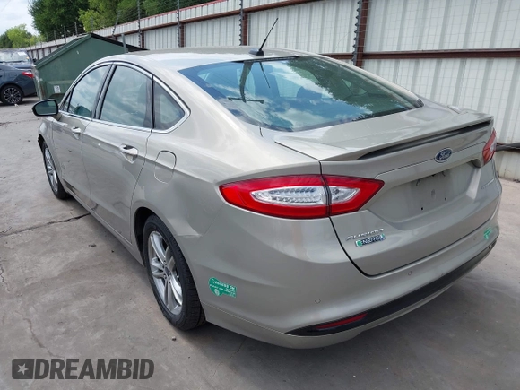 2015 Ford Fusion Energi Titanium with VIN 3FA6P0SU3FR114739, listed as a IAAI auction lot 42003011 with 120,553 mi miles. Bid and sale history available at carsss.com. Image 3.