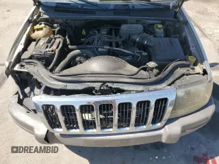 2003 Jeep Grand Cherokee Laredo with VIN 1J4GW48S23C524693, listed as a Copart auction lot 64461755 with 243,936 mi miles and Salvage title. Bid and sale history available at DreamBid. Image 12.