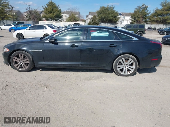 2013 Jaguar XJ Portfolio with VIN SAJWJ2GDXD8V55879, listed as a IAAI auction lot 41568366 with 121,119 mi miles and . Bid and sale history available at DreamBid. Image 14.