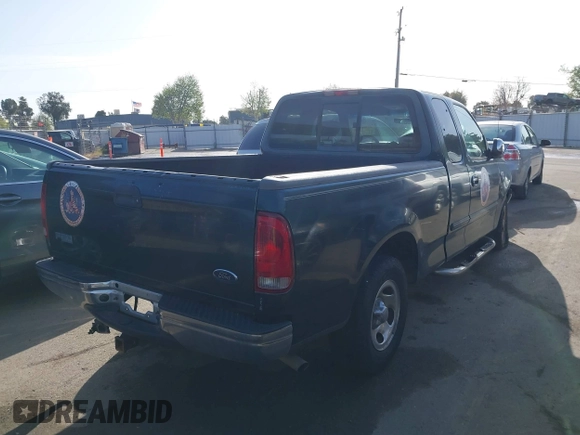 2002 Ford F-150 XL with VIN 1FTRX17L42NA52360, listed as a IAAI auction lot 41886697 with 121,346 mi miles. Bid and sale history available at carsss.com. Image 4.