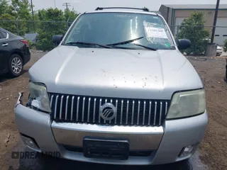 2005 Mercury Mariner Luxury z VIN 4M2CU57135DJ23718, wystawiony jako IAAI lot #42441869 z przebiegiem 179 378 mil mil oraz . Historia ofert i sprzedaży dostępna na DreamBid. Obrazek 12.