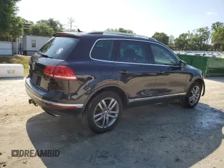 2015 Volkswagen Touareg Lux с VIN WVGEP9BP4FD004212, выставлен на аукционе Copart как лот 54021345 с пробегом 156 164 миль миль и Списание • Salvage title. История ставок и продаж доступна на DreamBid. Изображение 3.