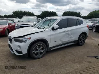 2018 BMW X1 xDrive28i with VIN WBXHT3C39J5F91943, listed as a Copart auction lot 63497885 with 88,002 mi miles and Clean title. Bid and sale history available at DreamBid. Image 1.