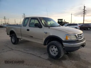 1999 Ford F-150 z VIN 2FTRX18W3XCA06671, wystawiony jako Copart lot #85561784 z przebiegiem 100 579 mil mil oraz Szkoda całkowita • Salvage title. Historia ofert i sprzedaży dostępna na DreamBid. Obrazek 4.