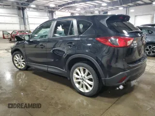 2014 Mazda CX-5 Grand Touring with VIN JM3KE4DY0E0322606, listed as a Copart auction lot 54381815 with 216,022 mi miles and Salvage Title. Bid and sale history available at DreamBid. Image 2.