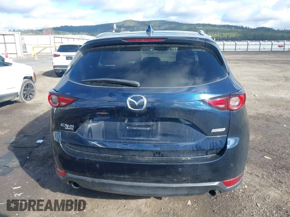 2019 Mazda CX-5 Signature with VIN JM3KFBEY5K0609063, listed as a IAAI auction lot 41802772 with 104,112 mi miles. Bid and sale history available at carsss.com. Image 17.