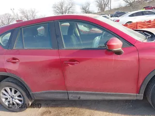 2014 Mazda CX-5 Sport with VIN JM3KE4BE6E0370104, listed as a IAAI auction lot 41879275 with 183,882 mi miles. Bid and sale history available at carsss.com. Image 13.