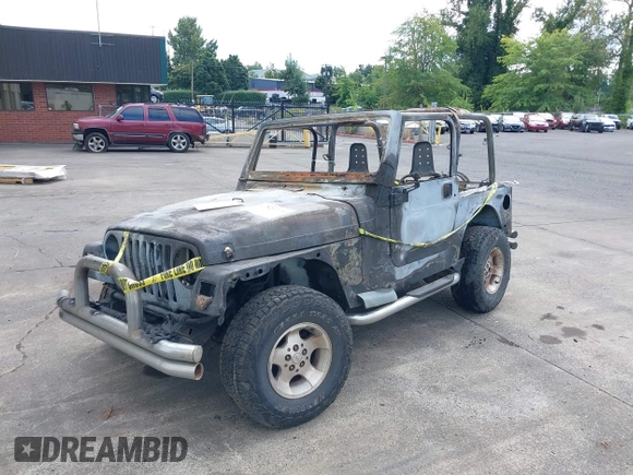 2000 Jeep Wrangler Sport with VIN 1J4FA49S5YP797345, listed as a IAAI auction lot 40322775 with Not Provided miles and . Bid and sale history available at DreamBid. Image 2.