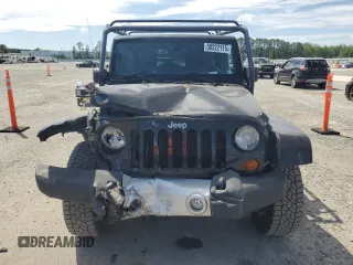 2012 Jeep Wrangler Unlimited Sahara with VIN 1C4HJWEG5CL205826, listed as a Copart auction lot 58222115 with 98,940 mi miles and Salvage title. Bid and sale history available at DreamBid. Image 5.