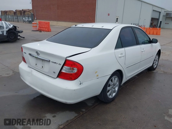 2003 Toyota Camry LE z VIN JTDBF30K530148403, wystawiony jako IAAI lot #41688346 z przebiegiem 299 143 mil mil oraz . Historia ofert i sprzedaży dostępna na DreamBid. Obrazek 4.