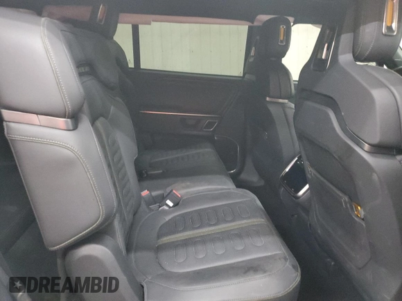 2023 Rivian R1S Adventure z VIN 7PDSGABA2PN013659, wystawiony jako Copart lot #53475945 z przebiegiem 13 928 mil mil oraz Szkody całkowita. Historia ofert i sprzedaży dostępna na DreamBid. Obrazek 12.