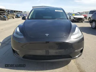 2024 Tesla Model Y with VIN 7SAYGDED0RF131495, listed as a Copart auction lot 56849765 with 10,120 mi miles and Salvage title. Bid and sale history available at DreamBid. Image 5.