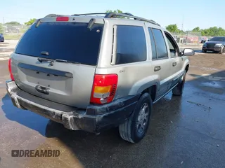 2000 Jeep Grand Cherokee Laredo z VIN 1J4GW48S8YC244168, wystawiony jako IAAI lot #41907447 z przebiegiem 243 154 mil mil oraz . Historia ofert i sprzedaży dostępna na DreamBid. Obrazek 4.