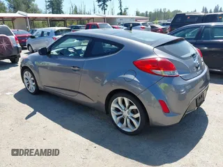 2012 Hyundai Veloster w/Black Int with VIN KMHTC6AD5CU030788, listed as a IAAI auction lot 42774337 with 104,297 mi miles and . Bid and sale history available at DreamBid. Image 3.