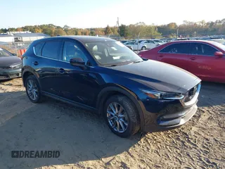 2021 Mazda CX-5 Grand Touring Reserve with VIN JM3KFBAYXM0465762, listed as a IAAI auction lot 40728368 with 30,667 mi miles. Bid and sale history available at carsss.com. Image 1.