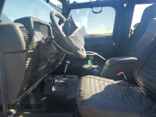 2005 Jeep Wrangler SE with VIN 1J4FA29S65P330905, listed as a Copart auction lot 71633134 with 77,598 mi miles and Salvage Title. Bid and sale history available at carsss.com. Image 7.