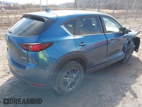 2021 Mazda CX-5 Touring with VIN JM3KFBCM4M0404093, listed as a IAAI auction lot 41751343 with 50,536 mi miles. Bid and sale history available at carsss.com. Image 4.