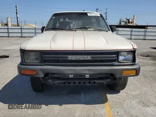 1989 Toyota Pickup z VIN JT4RN81R4K0003524, wystawiony jako Copart lot #56073845 z przebiegiem 153 704 mil mil oraz Tytuł czysty. Historia ofert i sprzedaży dostępna na DreamBid. Obrazek 5.