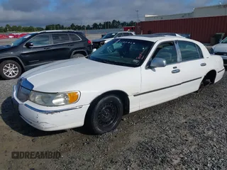 1999 Lincoln Town Car Signature with VIN 1LNHM82W0XY710627, listed as a IAAI auction lot 42440024 with 268,639 mi miles and . Bid and sale history available at DreamBid. Image 2.