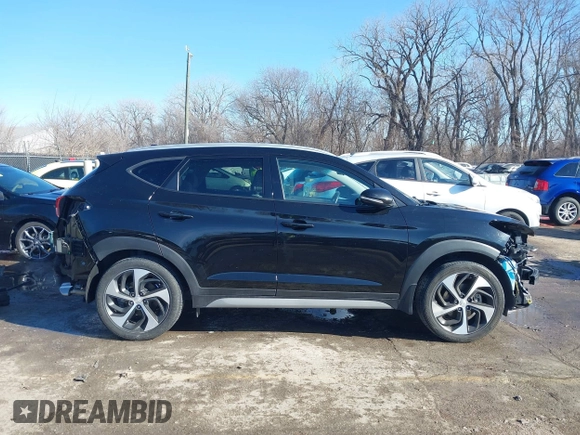 2018 Hyundai Tucson Sport with VIN KM8J33ALXJU771481, listed as a IAAI auction lot 41399335 with 64,905 mi miles. Bid and sale history available at carsss.com. Image 14.