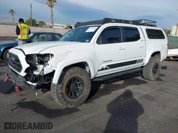 2019 Toyota Tacoma SR z VIN 3TMCZ5AN6KM284101, wystawiony jako IAAI lot #41099466 z przebiegiem 36 119 mil mil oraz . Historia ofert i sprzedaży dostępna na DreamBid. Obrazek 17.