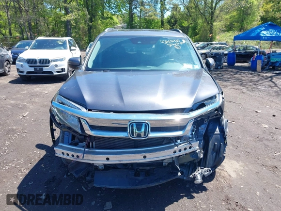 2021 Honda Pilot Touring 8-Passenger z VIN 5FNYF6H9XMB059037, wystawiony jako IAAI lot #42202410 z przebiegiem 49 267 mil mil oraz . Historia ofert i sprzedaży dostępna na DreamBid. Obrazek 12.