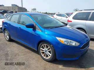 2018 Ford Focus SE z VIN 1FADP3FE1JL254632, wystawiony jako IAAI lot #42408683 z przebiegiem 74 696 mil mil oraz . Historia ofert i sprzedaży dostępna na DreamBid. Obrazek 1.