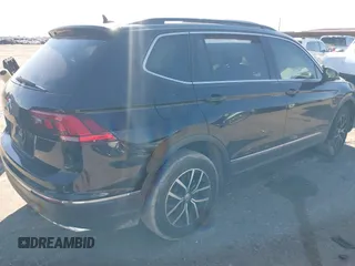 2021 Volkswagen Tiguan SE z VIN 3VV3B7AX4MM095811, wystawiony jako IAAI lot #41476490 z przebiegiem 25 668 mil mil oraz . Historia ofert i sprzedaży dostępna na DreamBid. Obrazek 4.