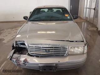 2005 Ford Crown Victoria LX with VIN 2FAFP74W95X158705, listed as a IAAI auction lot 41593553 with 276,940 mi miles. Bid and sale history available at carsss.com. Image 12.