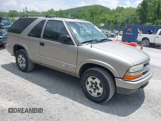 2003 Chevrolet Blazer LS z VIN 1GNCT18X23K173241, wystawiony jako IAAI lot #42410493 z przebiegiem 97 147 mil mil oraz . Historia ofert i sprzedaży dostępna na DreamBid. Obrazek 1.