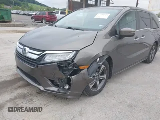 2018 Honda Odyssey Touring with VIN 5FNRL6H89JB057148, listed as a IAAI auction lot 42511909 with 166,438 mi miles and . Bid and sale history available at DreamBid. Image 6.