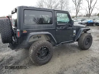 2014 Jeep Wrangler Sahara with VIN 1C4AJWBG0EL306703, listed as a Copart auction lot 51450215 with 115,932 mi miles and Salvage Title. Bid and sale history available at DreamBid. Image 3.