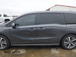 2021 Honda Odyssey Touring with VIN 5FNRL6H86MB021504, listed as a IAAI auction lot 41550040 with 55,068 mi miles. Bid and sale history available at carsss.com. Image 15.