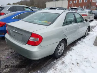 2004 Toyota Camry LE with VIN 4T1BF32K64U588682, listed as a IAAI auction lot 41520570 with 112,646 mi miles. Bid and sale history available at carsss.com. Image 4.