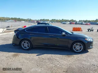 2015 Ford Fusion Titanium Hybrid with VIN 3FA6P0RUXFR119698, listed as a IAAI auction lot 41791411 with 140,646 mi miles. Bid and sale history available at carsss.com. Image 14.