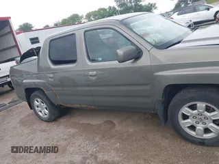 2007 Honda Ridgeline RTL with VIN 2HJYK16517H513832, listed as a IAAI auction lot 42626411 with 209,171 mi miles and . Bid and sale history available at DreamBid. Image 13.